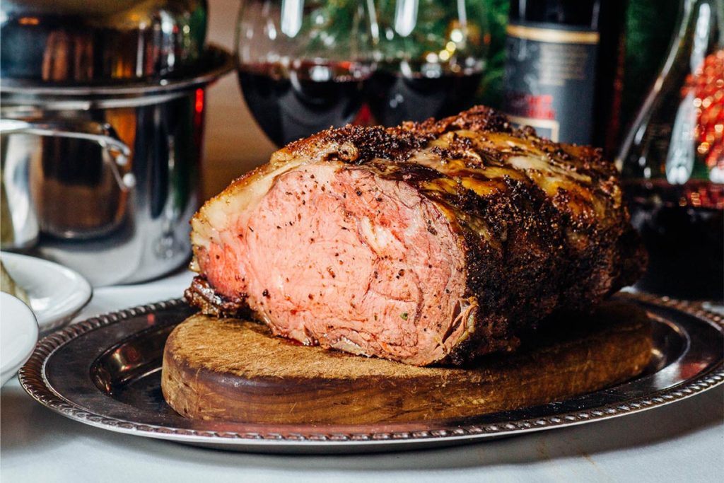 marinated bison prime rib roast on a serving platter